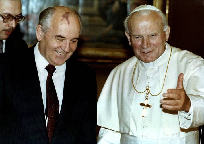 Pope John Paul II greets Soviet leader Mikhail Gorbachev at the Vatican Nov. 18, 1990.