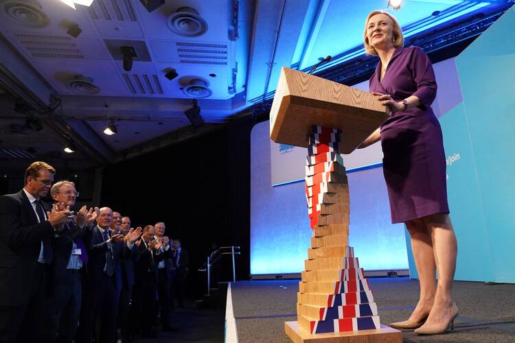 Liz Truss speaks at the Queen Elizabeth II Center in London, after being announced as the new British prime minister.