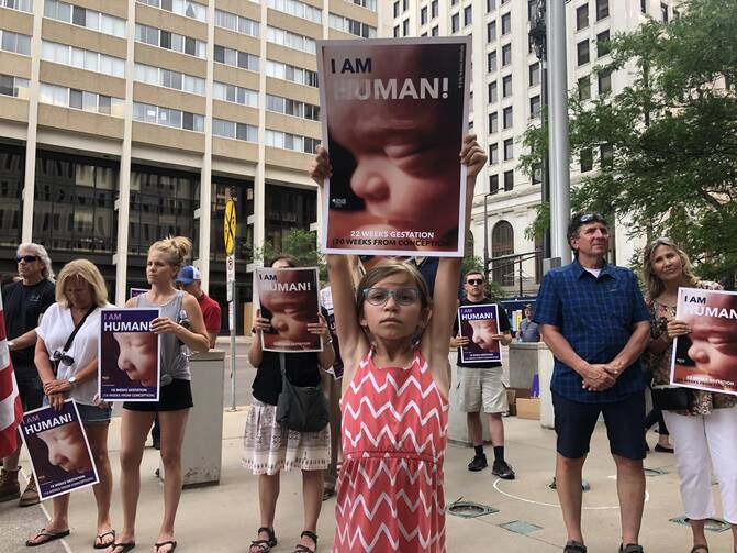 Marie Keating of St. John Neumann in Eagan, Minn., holds a pro-life sign at a June 24, 2022, rally in downtown St. Paul. 9CNS photo/Dave Hrbacek, The Catholic Spirit)