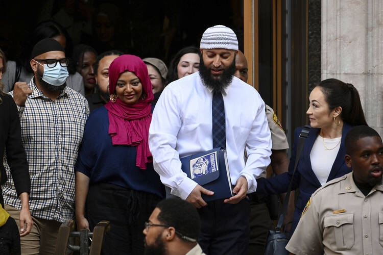 Adnan Syed, the man whose legal saga spawned the hit podcast "Serial," exits the Cummings Courthouse a free man after a Baltimore judge overturned his conviction for the 1999 murder of high school student Hae Min Lee, Sept. 19, in Baltimore. (Jerry Jackson/The Baltimore Sun via AP)
