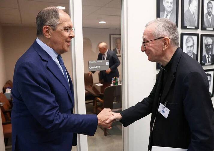 Two men shake hands at the United Nations