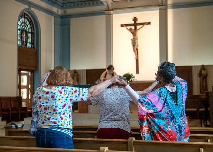 A handful of parishioners in the Gardenville neighborhood of Baltimore attend daily Mass.