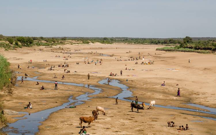 A massive drought in southern Madagascar, with a dried up river.