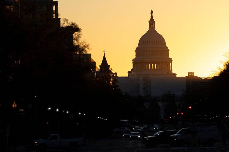 The sun rises over the U.S. Capitol in Washington Nov. 9, 2022, as election results continued to be tallied across the U.S. to determine control of Congress. (CNS photo/Tom Brenner, Reuters)