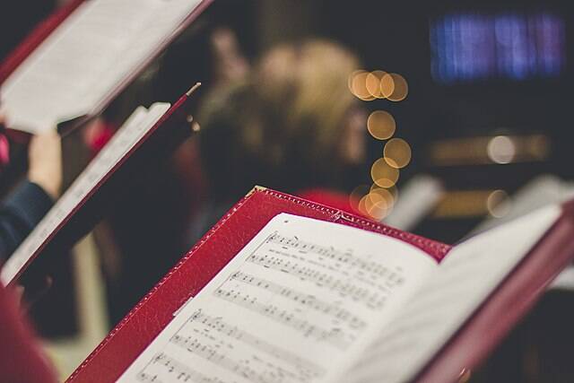 A red book containing sheet music 