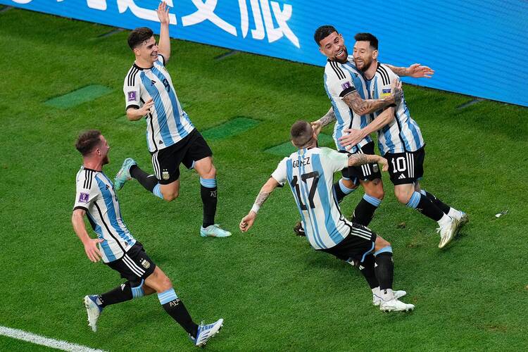 lionel messi celebrates on the field with teammates in the game against australia