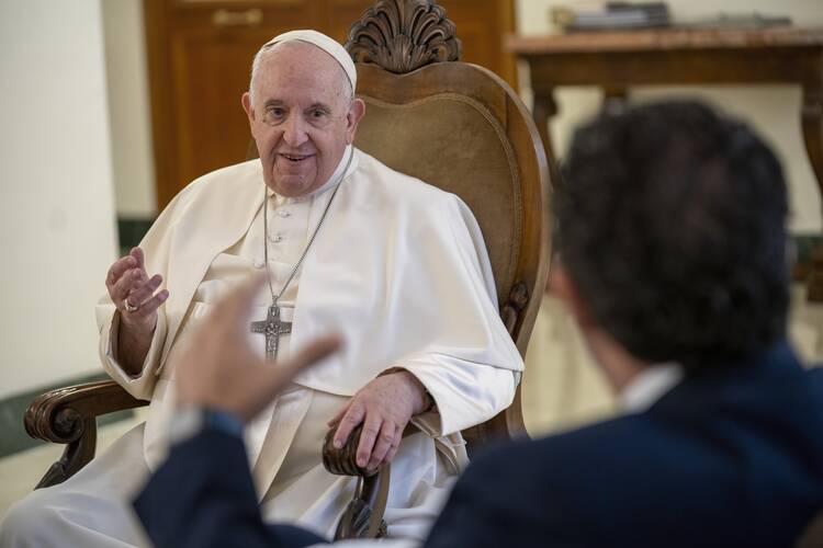 pope francis smiles as he speaks with journalists in his private quarters with spanish newspaper