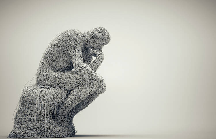 a thinker crouches in thought with white background