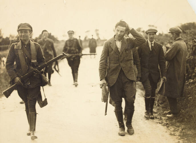 A prisoner under escort at the South Western Front during the Irish Civil War: July 22, 1922. Courtesy of National Library of Ireland Ref.: HOG106.