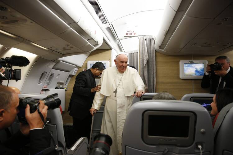 Pope Francis is pictured after answering questions from journalists aboard his flight from Iqaluit, in the Canadian territory of Nunavut, to Rome July 29, 2022.