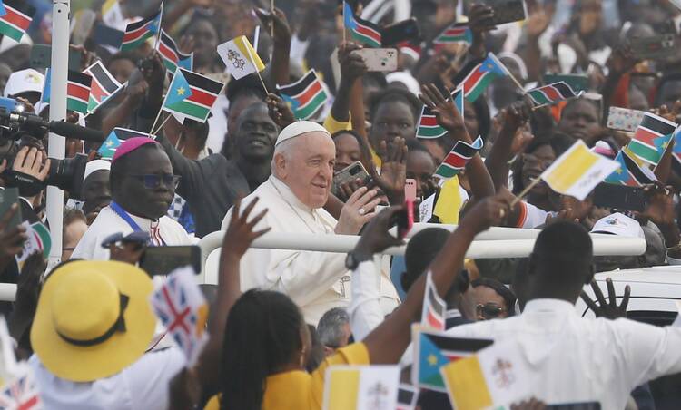 Pope Francis greets the crowd as he arrives to celebrate Mass at the John Garang Mausoleum in Juba, South Sudan, Feb. 5, 2023.