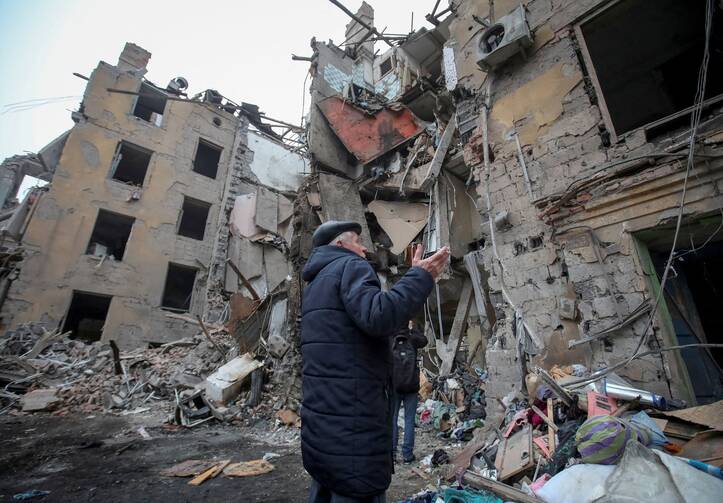 A local resident gestures outside a residential building in Kramatorsk, Ukraine, Feb. 2, 2023, which was destroyed by a Russian missile strike. (OSV News photo/Vyacheslav Madiyevskyy, Reuters)