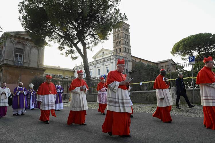 cardinals processing outside in rome