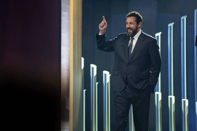 Adam Sandler on stage at the Kennedy Center for the Performing Arts