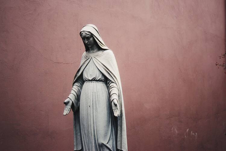 Statue of the Blessed Mother with her hands outstretched.