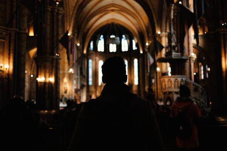 Man walking down aisle of a church