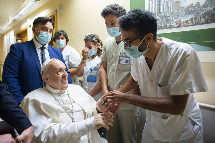 pope francis greets medical workers in a hospital in 2021