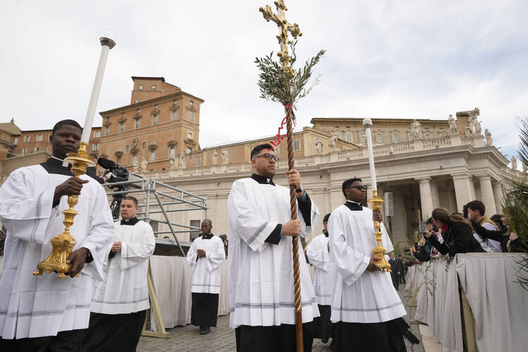 Palm bearers arrive in a procession at the start of the Palm Sunday Mass celebrated by Pope Francis in St. Peter's Square at the Vatican on April 2, 2023. (AP Photo/Andrew Medichini)