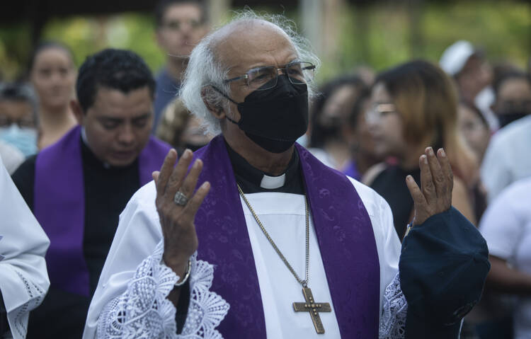 Catholic Cardinal Leopoldo Brenes leads a re-enactment of the Stations of the Cross during the Lenten season at the Metropolitan Cathedral in Managua, Nicaragua, on March 17, 2023. Catholics staged the devotional commemoration in the gardens of the cathedral due to the police ban on celebrating religious festivities on the streets. (AP Photo/Inti Ocon)