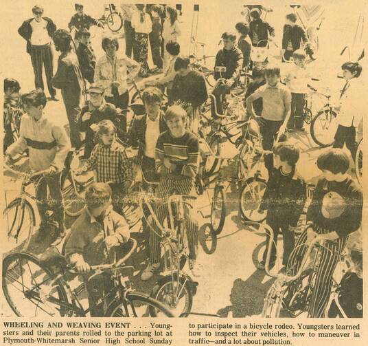 a scanned image from a newspaper with kids on bikes. father james martin is in the photo as a child