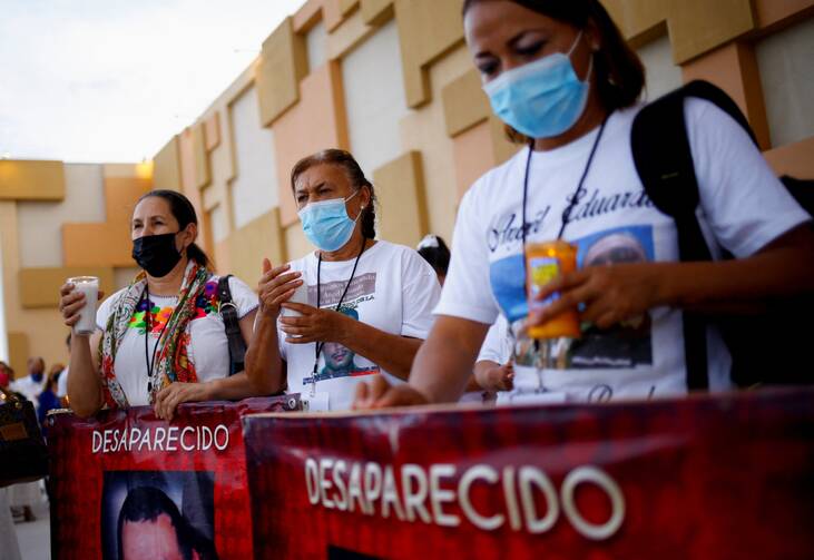 People with missing relatives and victims of violence walk in a procession in Ciudad Juarez, Mexico July 28, 2022, in memory of their loved ones as part of the Praying Days for Peace called by the Catholic Church due to the ongoing violence in Mexico. (CNS photo/Jose Luis Gonzalez, Reuters)