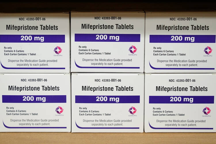 white and purple boxes of the drug mifepristone