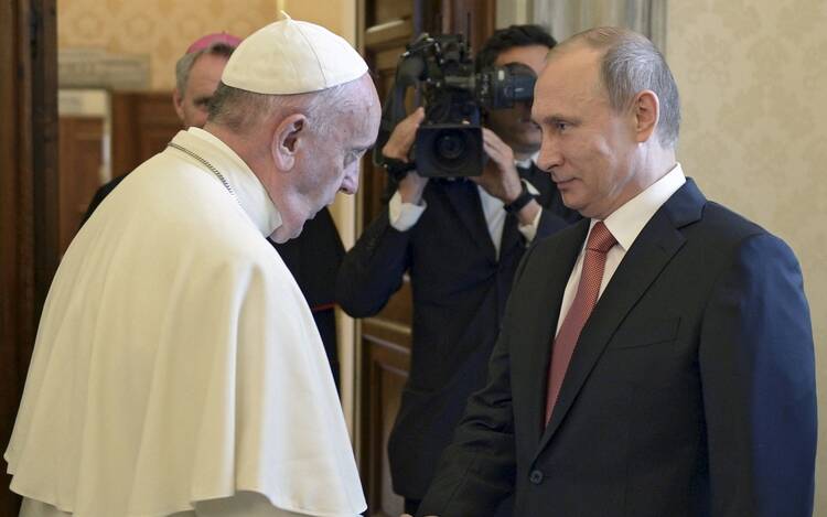 Pope Francis greets Russian President Vladimir Putin as he arrives for private meeting at Vatican.