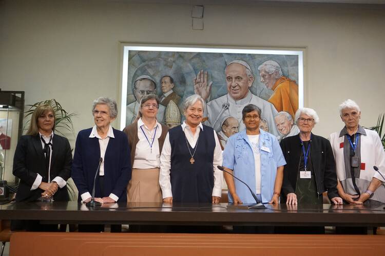 Women leaders, who were part of a delegation to Rome with Catholic Extension, stand at the beginning of a news conference at the Vatican April 27, 2023. Pictured from left to right are: Melva Arbelo; Sister Carol Keehan, a Daughter of Charity; Teresian Sister Clarice Suchy; Sister Norma Pimentel, a member of the Missionaries of Jesus; Sister Fatima Santiago, a member of the Missionary Sisters of the Immaculate Heart of Mary; Sister Marie-Paule Willem, a Franciscan Missionary of Mary; and Jean Fedigan. (CNS 