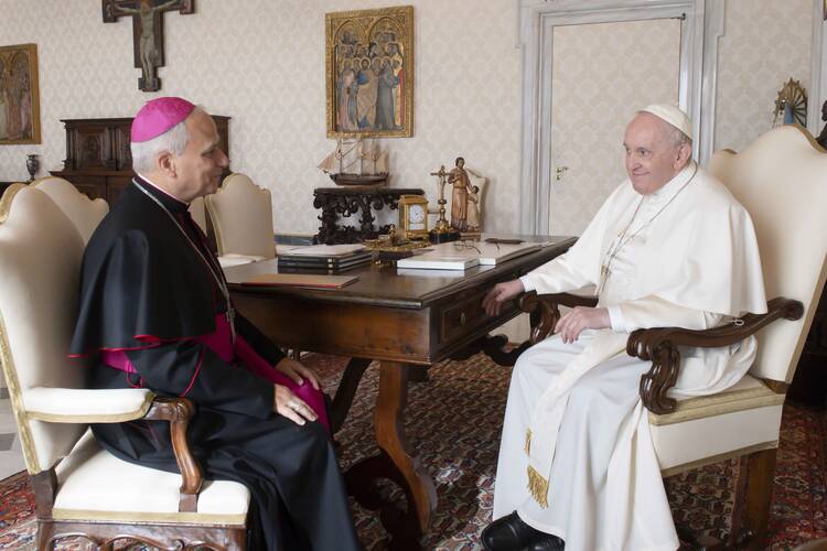 Archbishop Robert F. Prevost sat across from Pope Francis in the Vatican during a private audience meeting.