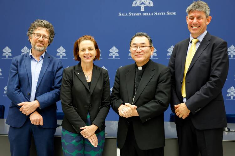 Members of the leadership team of Caritas Internationalis, elected during the organization's general assembly, meet reporters at the Vatican press office May 16, 2023. From left are: Patrick Debucquois, treasurer; Kirsty Robertson, vice president; Archbishop Tarcisius Isao Kikuchi of Tokyo; and Alistair Dutton, secretary-general. (CNS photo/Lola Gomez)