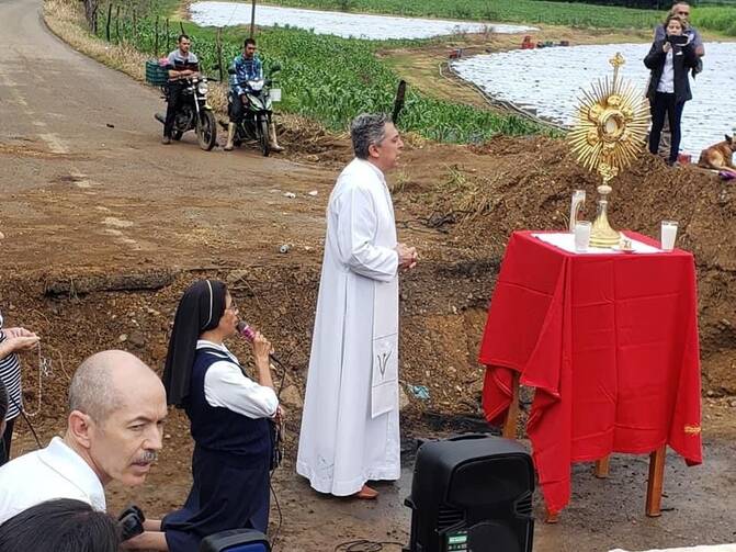 A Catholic priest performs mass in a Mexican town