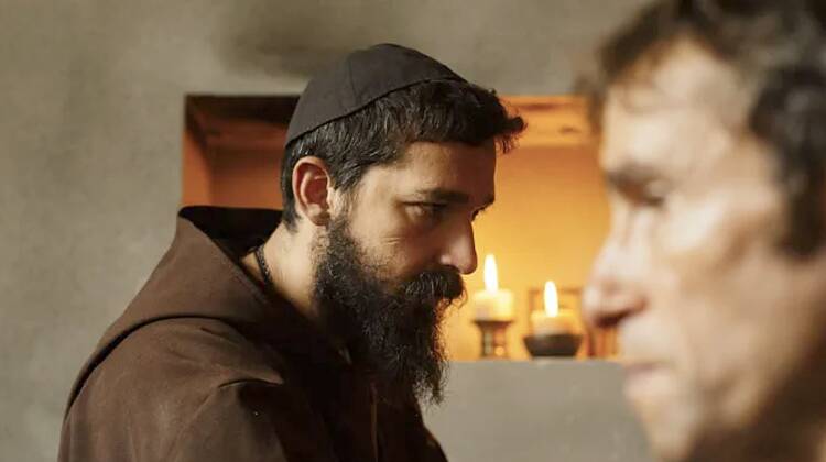 An actor depicting a Catholic brother appears on screen