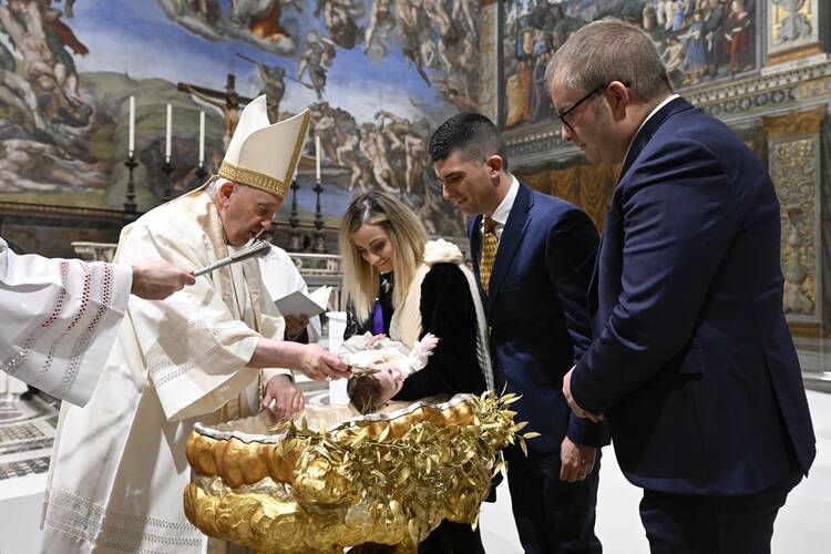 Catholic Pope baptizes a baby in a gilded font