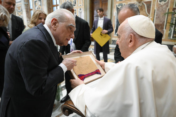 Martin Scorsese gives Pope Francis a copy of the “Our Father: written in Osage, from Scorsese’s new movie “Killers of the Flower Moon.” (Photo courtesy of Michael Murphy)