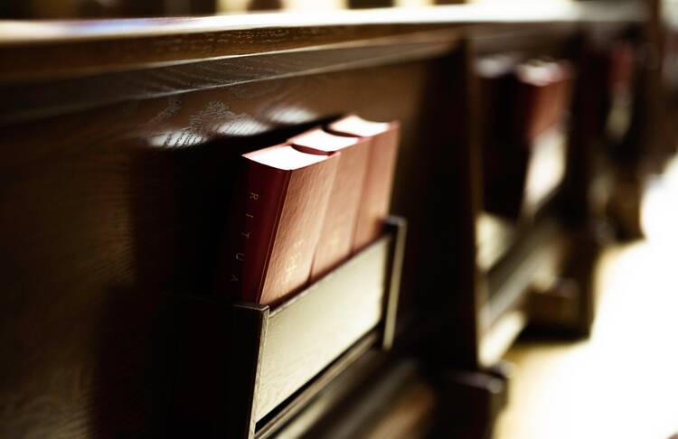 hymnals behind a pew