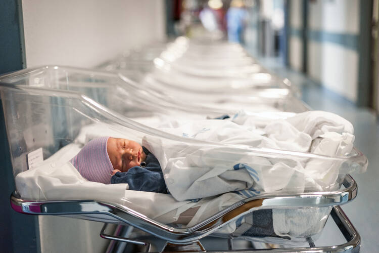 A photo of a baby in a nursery