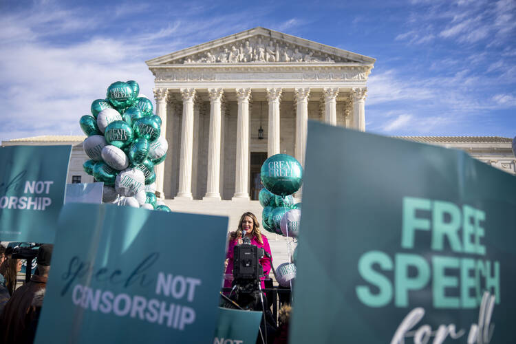 Lorie Smith, a Christian graphic artist and website designer in Colorado, speaks to supporters outside the Supreme Court on Dec. 5, 2022, after having her case heard by the court. (AP Photo/Andrew Harnik, File)