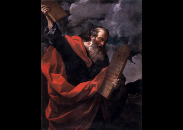Moses holds tablets of ten commandments