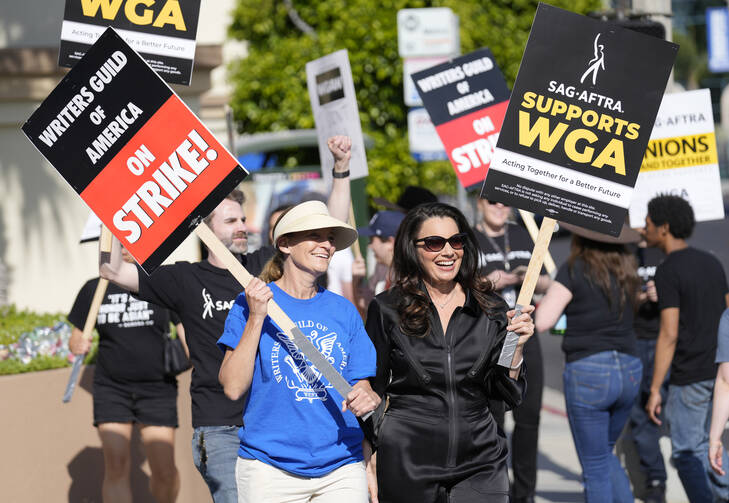 Meredith Stiehm, president of Writers Guild of America West, and Fran Drescher, president of SAG-AFTRA, take part in a rally by striking writers outside Paramount Pictures studio in Los Angeles on May 8, 2023. (AP Photo/Chris Pizzello, File)
