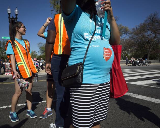 A pregnant woman is seen outside the U.S. Supreme Court in Washington in this 2016 file photo. 