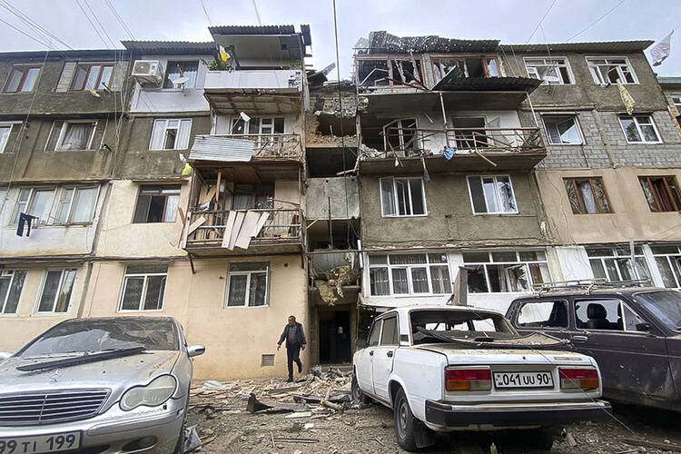 A damaged residential apartment building following shelling is seen in Stepanakert, Nagorno-Karabakh. Azerbaijan on Tuesday, Sept. 19, 2023, declared that it started what it called an "anti-terrorist operation" targeting Armenian military positions in the Nagorno-Karabakh region and officials in that region said there was heavy artillery firing around its capital. (AP Photo/Siranush Sargsyan)