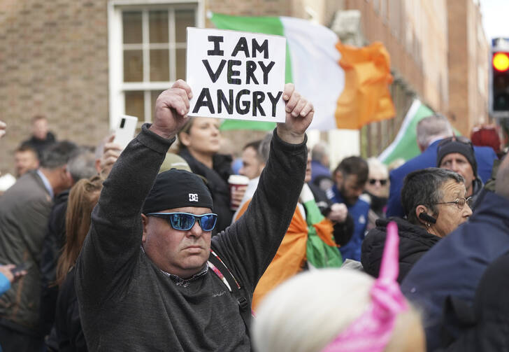 Protesters outside Leinster House, Dublin, as the Dail resumes after summer recess on Sept. 20. (Press Association via AP Images)