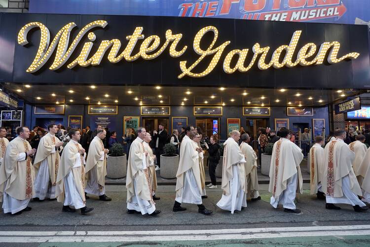 Priests participate in a Eucharistic procession through Midtown Manhattan in New York City Oct. 10, 2023. The procession and the Mass at St. Patrick's Cathedral that preceded it attracted more than 2,000 people. The services, which concluded with benediction at the cathedral, were affiliated with the Napa Institute's Principled Entrepreneurship Conference taking place in New York City Oct. 10-11. (OSV News photo/Gregory A. Shemitz)