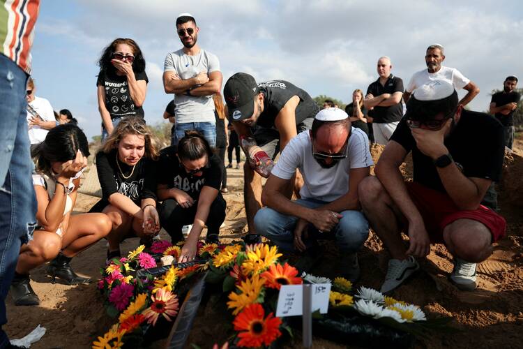 People mourn at the graveside of Eden Guez during her funeral in Ashkelon, Israel, Oct. 10, 2023. She was killed while attending a festival that was attacked by Hamas gunmen from Gaza. (OSV News photo/Violeta Santos Moura, Reuters)