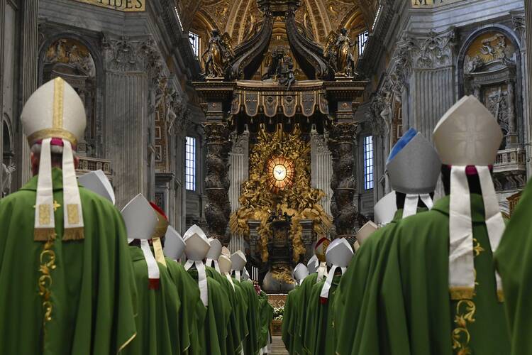 Bishops file into St. Peter’s Basilica at the Vatican on Oct. 29, 2023, for a Mass marking the conclusion of the first session of the Synod on Synodality. (CNS photo/Vatican Media)