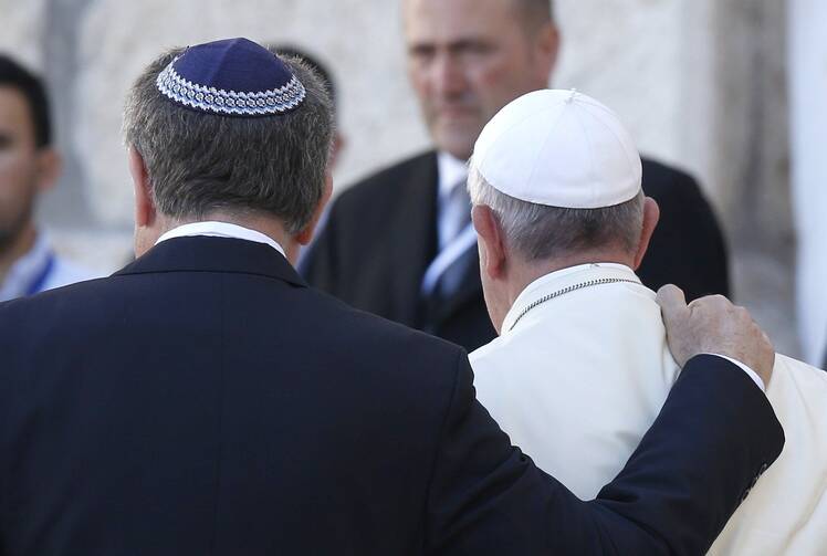 Rabbi Abraham Skorka of Buenos Aires, Argentina, and Pope Francis embrace after visiting the Western Wall in Jerusalem on May 26, 2014. (CNS photo/Paul Haring)