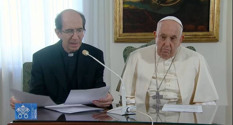 Monsignor Paolo Braida reading Pope Francis’s message on Dec. 3 (Vatican Media)