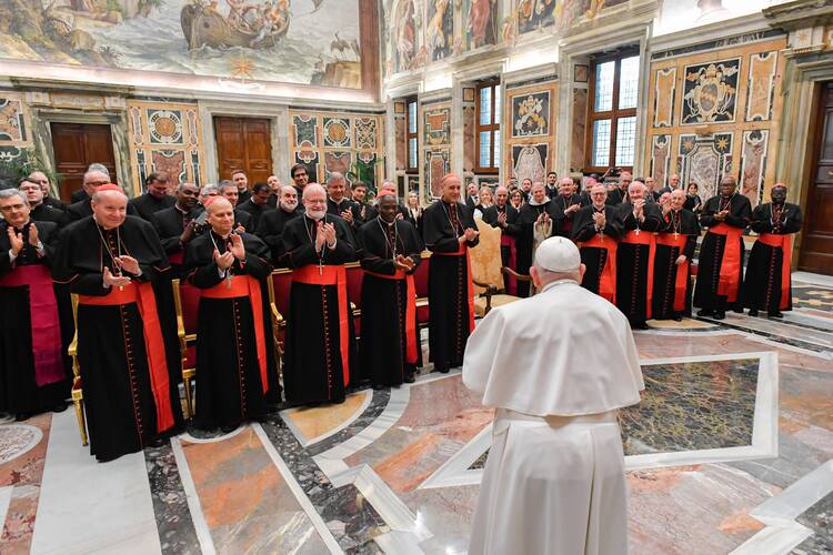 Pope Francis meets members of the Dicastery for the Doctrine of the Faith in the Apostolic Palace at the Vatican Jan. 26, 2024. In the front row from left are: Cardinals Christoph Schönborn, Robert Prevost, Seán P. O'Malley, Peter Turkson, Victor Manuel Fernández, Claudio Gugerotti, Marc Ouellet, Fernando Filoni, John Onaiyekan and Stephen Mulla. (CNS photo/Vatican Media)