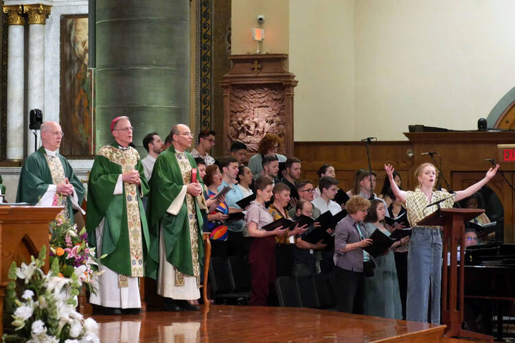 In this photo provided by America Media, from left, the Rev. James Martin, Archbishop John Wester of Santa Fe, N.M., and Rev. Eric Andrews attend the closing Mass for the Outreach conference at the Church of St. Paul the Apostle, in New York, June 18, 2023. Martin is the founder of Outreach, a unique Jesuit-run program of outreach to LGBTQ+ Catholics. (Cristobal Spielmann/America Media via AP)