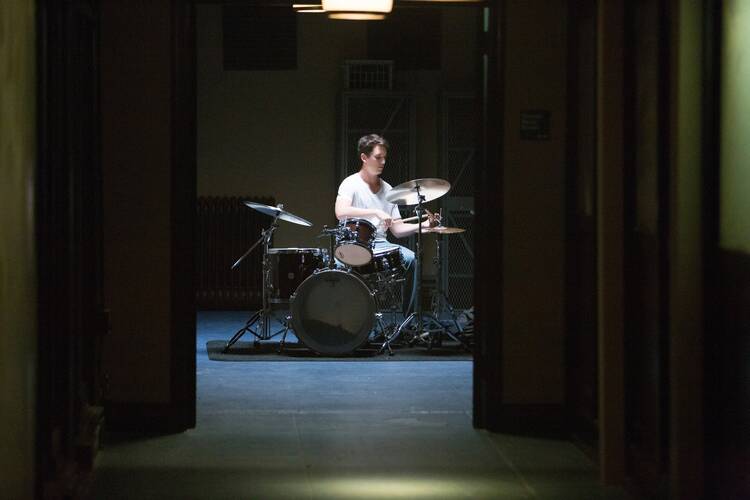 Miles Teller stars in a scene from the movie "Whiplash." (CNS photo/courtesy Sony Pictures Classics)